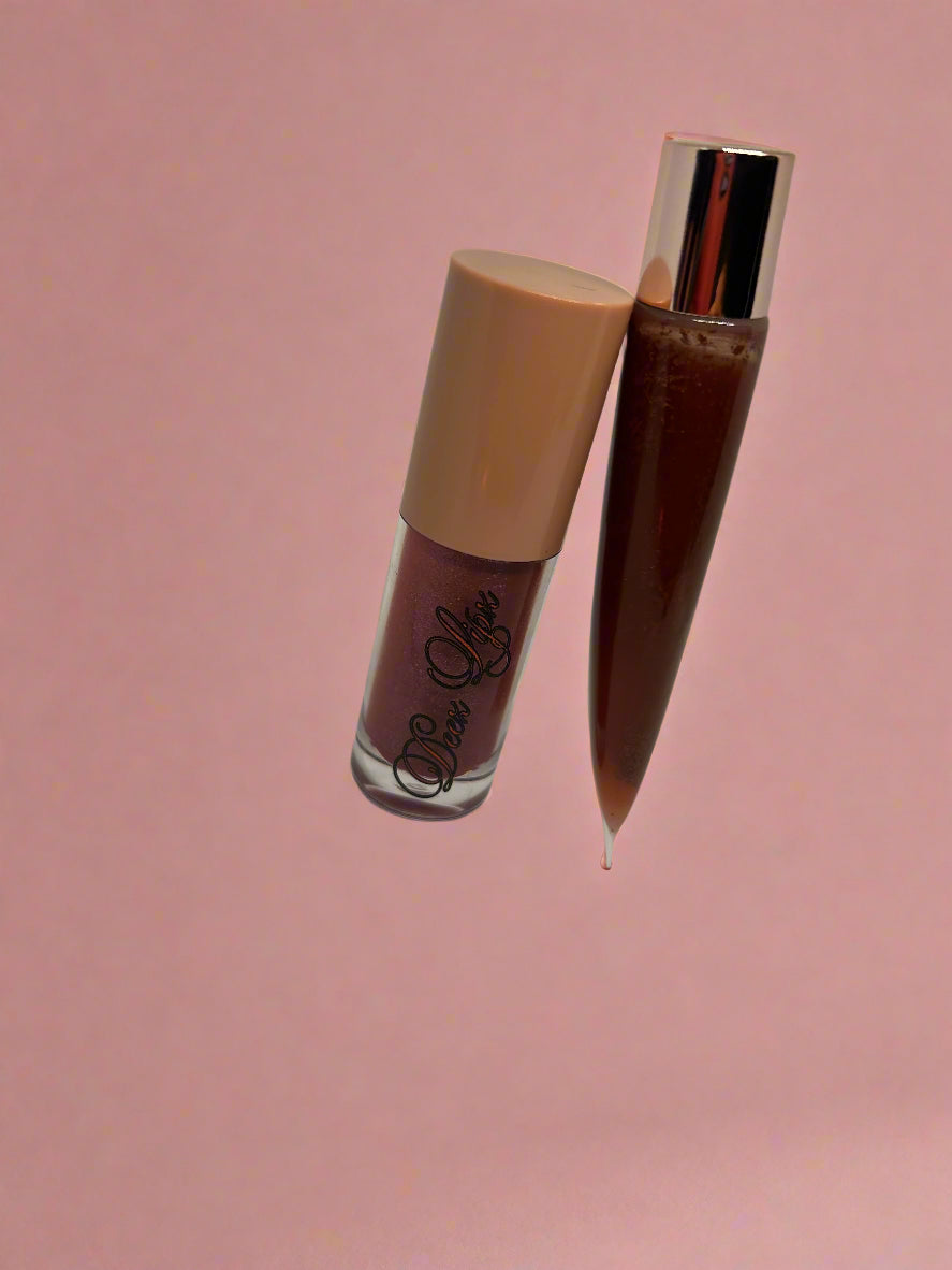 Two lipsticks on a light gray background