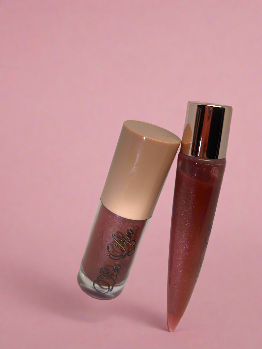 Lipstick with beige cap on a white background